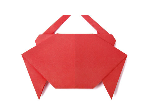 Origami crab recycled papercraft on a white