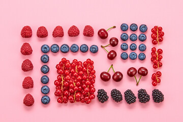Blueberry, raspberry, blackberry, redcurrant, strawberry, cherry layout. Fresh blueberry, berries mix on pink. Red raspberry, blue blackberry, mint creative composition. Colorful concept, top view.