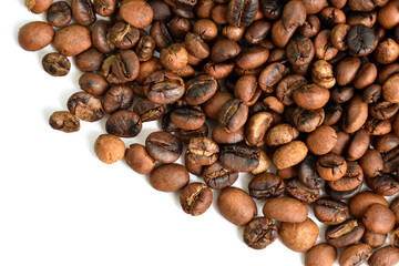 Roasted coffee beans placed on a white background