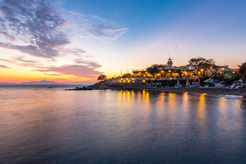 Fototapeta premium Huseyinburnu lighthouse night view in Turgutreis Town in Turkey.