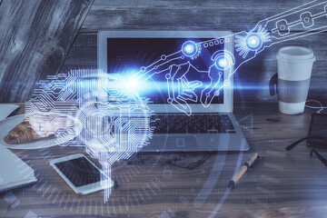 Multi exposure of work table with computer and brain hologram. Brainstorm concept.