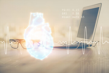 Desktop computer background and heart drawing. Double exposure. Medical study and healthcare concept.