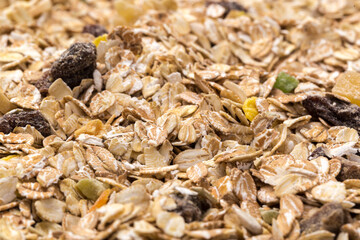 oatmeal with raisins, coconut, pineapple and banana slices isolated on a white background. For packing oatmeal or granola.