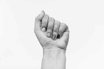Protest. Female fist protesting, black and white photo. Female hand raised up, strong and power concept. Women rights fight, skin and race diversity. Stop racism