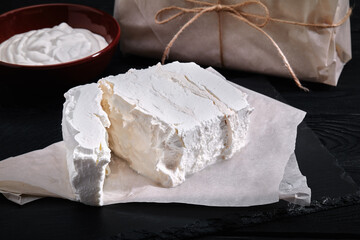 homemade cheese, milk and cottage cheese on a wooden background. rustic style. Set of dairy products, assortment of milk, cottage cheese, sour cream and yogurt