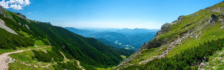 Fototapeta na wymiar Panoramic view from the Rax plateau down in the hilly landscape of Wechsel, Lower Austria
