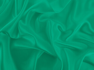 Beautiful elegant wavy emerald green satin silk luxury cloth fabric texture, abstract background design. Card or banner.