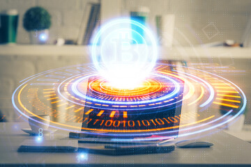 Multi exposure of blockchain theme hologram and table with computer background. Concept of bitcoin...