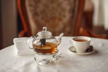 Tea Party with sweet cakes over table background in a charming classic restaurant