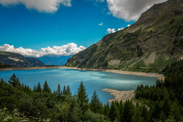 Naklejka na ściany i meble Tseusier lake in the Swiss Alps in Valais : Tseuzier lake is an artificial lake formed by the Tseuzier dam in the canton of Valais in Switzerland and close to the Anzère resort. Its located at 1,777 m