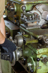 close up of a man using a machine, close up of a man working on a machine