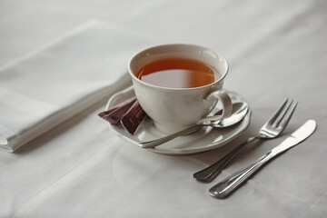 Tea Party with sweet cakes over table background in a charming classic restaurant