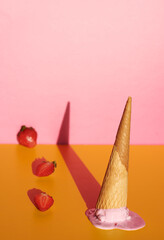Melted strawberry ice cream cone.
