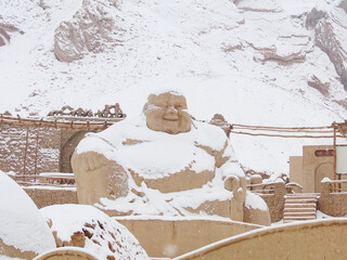 The Ten Thousands Buddha Caves in Flaming Mountains in Turpan in Xinjiang in?China, in Silk Road, high on the cliffs  the west Mutou Valley, covered by thick snow, was not seen in last 20 years. 