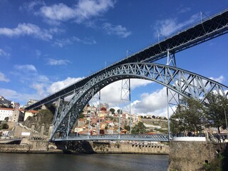 Dom Luis I Bridge and Porto city hill with houses. Porto / Portugal.