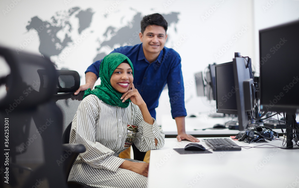 Wall mural Multiethnic startup business team with Arabian woman