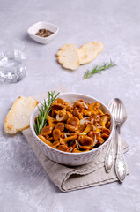 Fried chanterelle mushrooms with onions and rosemary