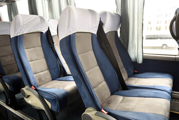 Comfortable bus seats backs without passengers, Intercity coach services, New bus interior with...
