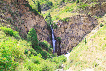 Kegeti waterfall. Background for tourism and travel. Summer landscape. Kegeti Gorge, Kyrgyzstan.
