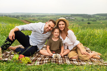 Happy family spending time together on a picnic