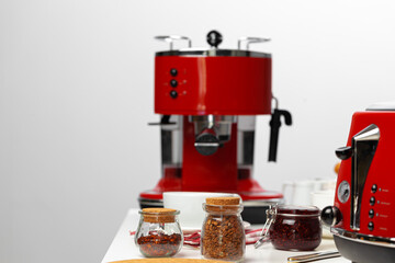 Close up of red kitchen .appliances on kitchen table