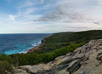 Fototapeta premium Beautiful and colorful rock formations along the sea cliff, Royal National Park, Sydney, New South Wales, Australia