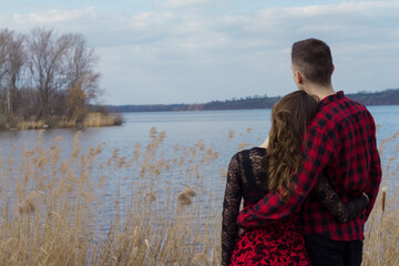 Romantic young couple in front of a lake in South Moravia, Czech Republic