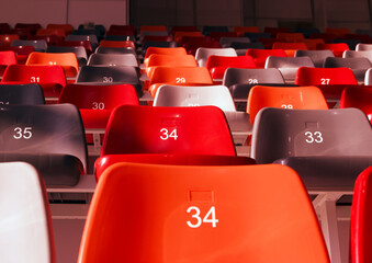 Fototapeta premium row of empty stadium seats colored