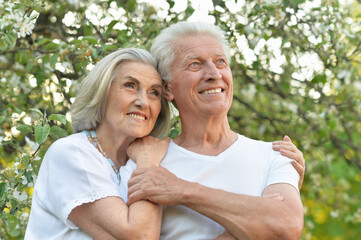 Portrait of beautiful senior couple posing in the park