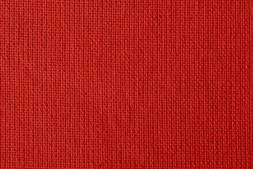 fabric with abstract pattern. red fiber texture polyester close-up. fine grain felt fabric background