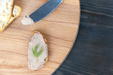 Fresh homemade chicken liver pate on wooden board