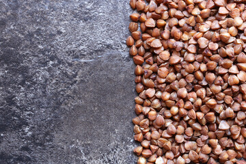 Buckwheat and brown background. Background split in half - one half buckwheat, the other brown asbractic background. Buckwheat . Space for text
