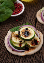 grill naan with zucchini on wood