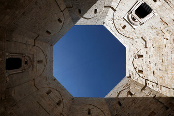 View of Castel del Monte, a Unesco world heritage medieval castle built on a solitary hill in Castel del Monte, Andria, Puglia, south of Italy.