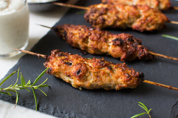 Homemade kebabs served with garlic sauce and rice.