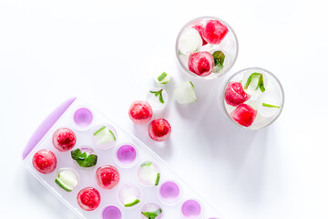 Naklejka na ściany i meble Raspberry and lime in ice cubes top view flat lay