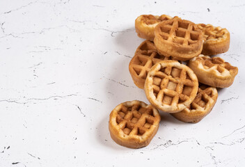 freshly baked waffles on a marble table