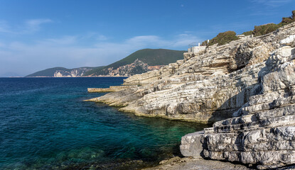 Natural seascape in the Greece. Seascape with rocky beach, turquoise water. Amazing nature Landscape. Wonderful summer day on the Emblisi beach. Kefalovia island.