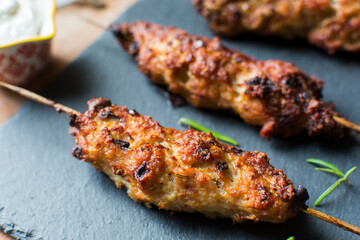 Homemade kebabs served with garlic sauce and rice.