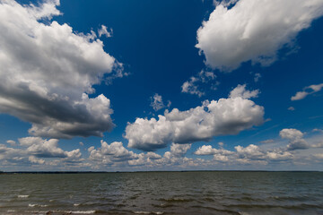 Cirrus clouds on a sultry summer day. A rare view of cirrus clouds on a calm day. Spindrift clouds. Background. Landscape.