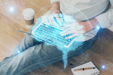 Fototapeta na wymiar Businessman with computer background with brain theme hologram. Concept of brainstorm. Multi exposure.