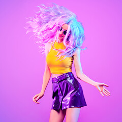 Fashion. Disco party woman have fun. DJ girl crazy dance in colorful neon light. Beautiful model,...