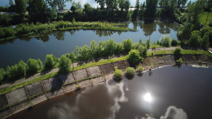 Aerial view of river Kama, Perm krai, Russia. Highway in the middle of the river. Rural landscape...