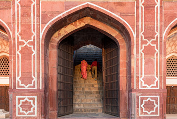 Unrecognised people walking to the entrance of Humayun's Tomb in New Delhi, India