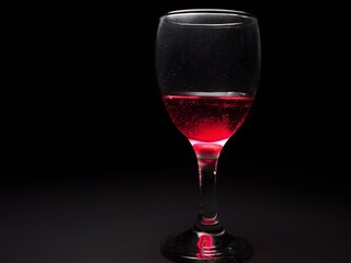 Red liquid in glass. Soft drink