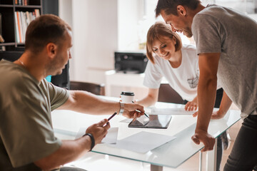 Fototapeta premium Young creative team of designers is developing a new interior project in modern creative studio