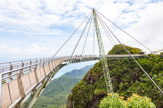 The sky bridge in the north of Langkawi, Malaysia. The landmark of the small Malaysian Island. One pillar and 12 cable holding the bridge over the valley. A  breathtaking view over the Andaman Sea 