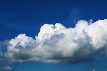 Naklejka na ściany i meble beautiful heap dark blue sky white cloud in the autumn and sunlight