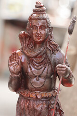 Colorful Beautiful Painted Handcrafted Statue Of Indian Hindu Lord Idol Shankar Shiva Bhagwan God Of Destruction Har Har Mahadev With Snake Made OfClay Stone Or Rock For Worship Pooja Puja In Festival