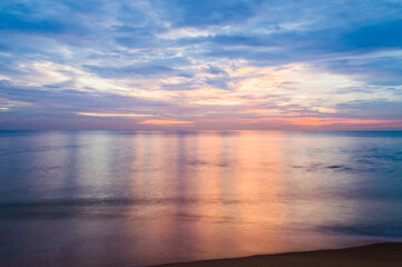 Obraz premium Colorful Sun Sky and reflections in water